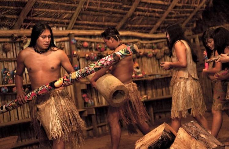 Indigenous community sharing traditions and instruments near La Fortuna, Costa Rica