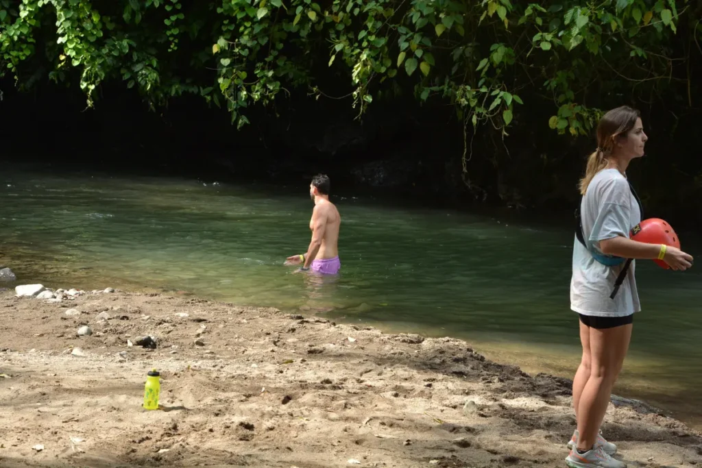 travelers enjoying river stop during Outback ATV tour in La Fortuna