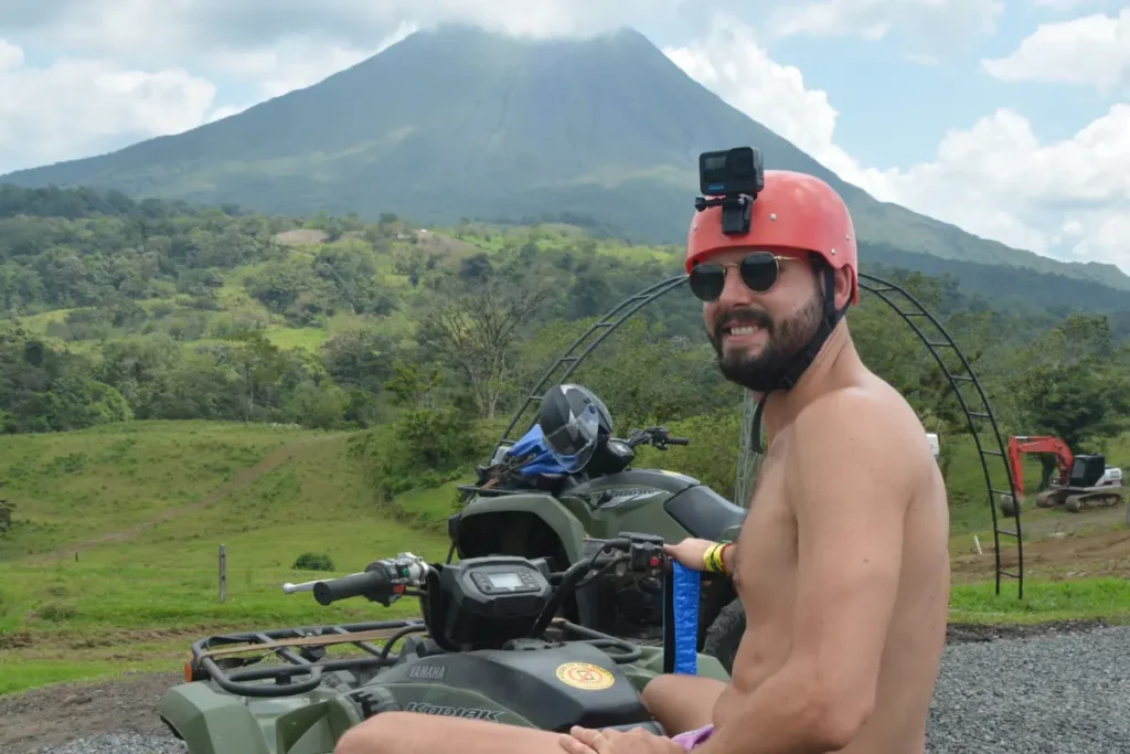 traveler with GoPro enjoying ATV tour near Arenal Volcano in La Fortuna